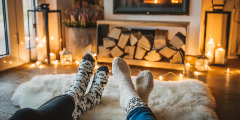 Romantic couple relaxing near fireplace