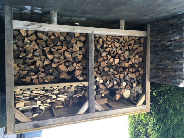 Log store made from oak sleepers
